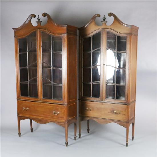 A near pair of Edwardian satinwood banded mahogany bookcases, W.3ft 3in. D.1ft 2in. H.6ft 6in.